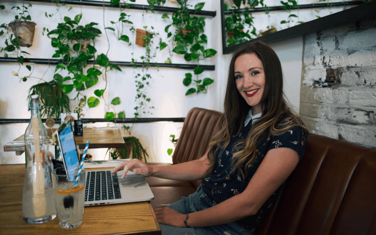 How to Get Paid to Travel and Earn a Full-Time Income as a Travel Blogger monica from the travel hack - interview with monica scott from the travel hack